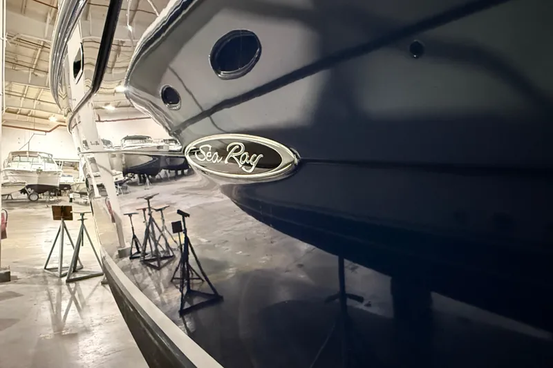 Slide: The Image of 2017 Sea Ray Sundancer 330 yacht in indoor storage, showcasing sleek design and luxury features. - 9