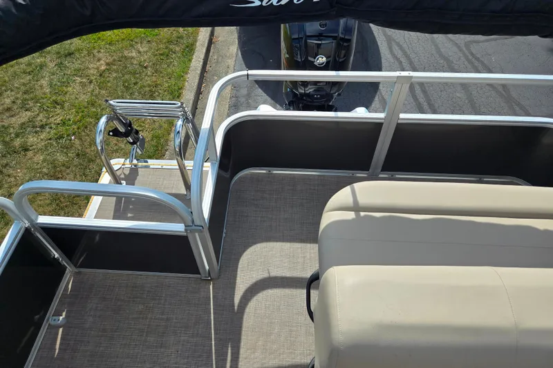 Slide: The Image of 2024 Sun Tracker Party Barge 18 DLX interior with seating and railing, viewed from above. - 15