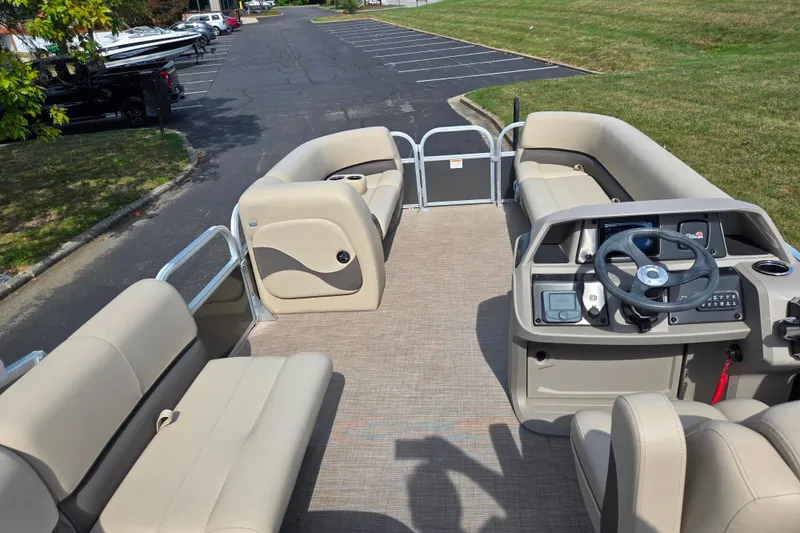Slide: The Image of 2024 Sun Tracker Party Barge 18 DLX pontoon boat with spacious seating and modern helm. - 17