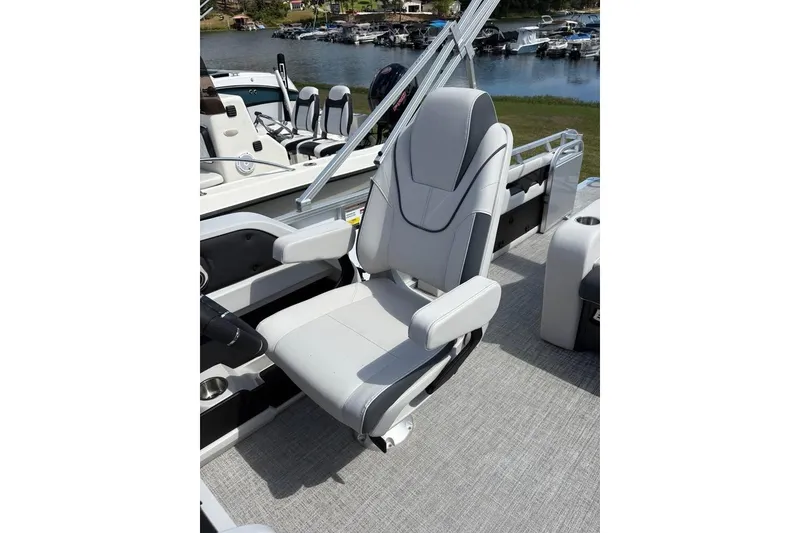 Slide: The Image of 2025 Avalon LSZ Entertainer boat seat with sleek design and comfortable armrests. - 4