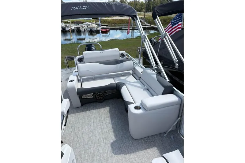 Slide: The Image of 2025 Avalon LSZ Entertainer pontoon boat interior with plush seating and modern design. - 6