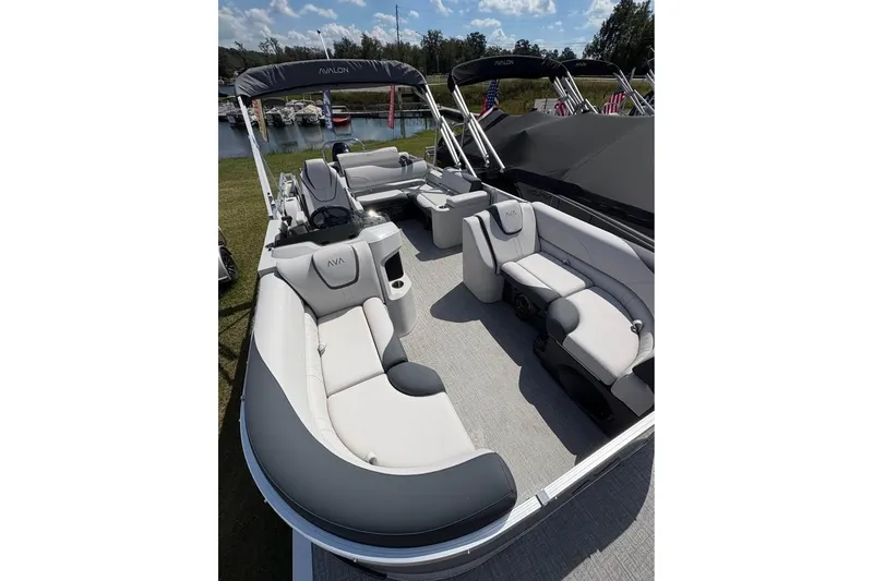 Slide: The Image of 2025 Avalon LSZ Entertainer pontoon boat with luxurious seating and modern design. - 9