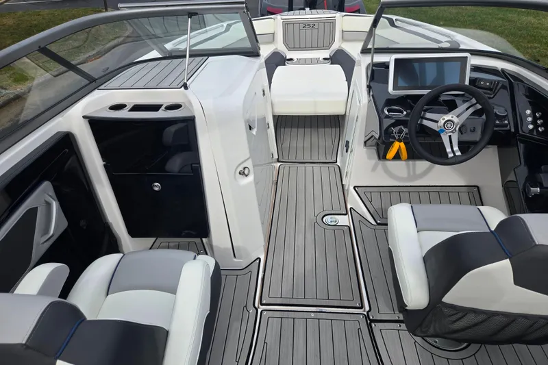 Slide: The Image of 2021 Yamaha Boats 252S interior with sleek design, modern dashboard, and comfortable seating. - 11