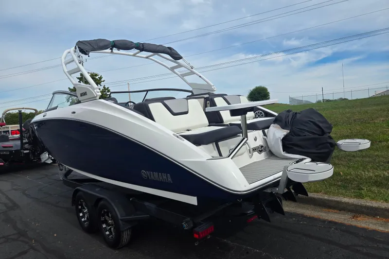 Slide: The Image of 2021 Yamaha Boats 252S on trailer, sleek design, parked outdoors. - 3