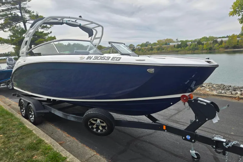 Slide: The Image of 2021 Yamaha Boats 252S on trailer by lakeside, ready for launch. - 8