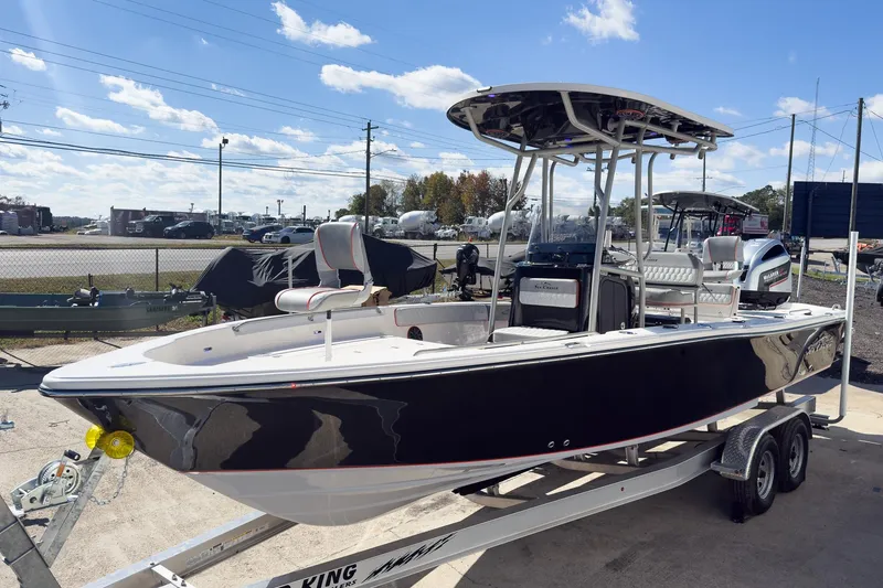 The Image of 2026 Sea Chaser 26 LX boat cruising on open water with passengers. - 0