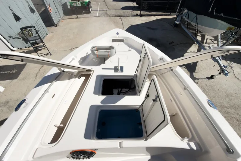 Slide: The Image of 2026 Sea Chaser 26 LX Special Edition boat displayed at an indoor exhibition. - 12