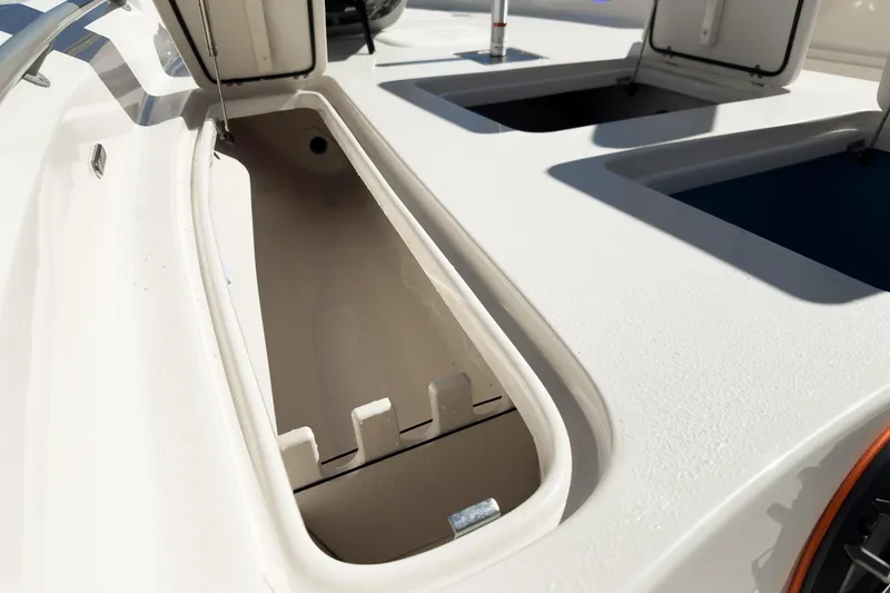 Slide: The Image of 2026 Sea Chaser 26 LX Special Edition boat displayed at an indoor showroom. - 13