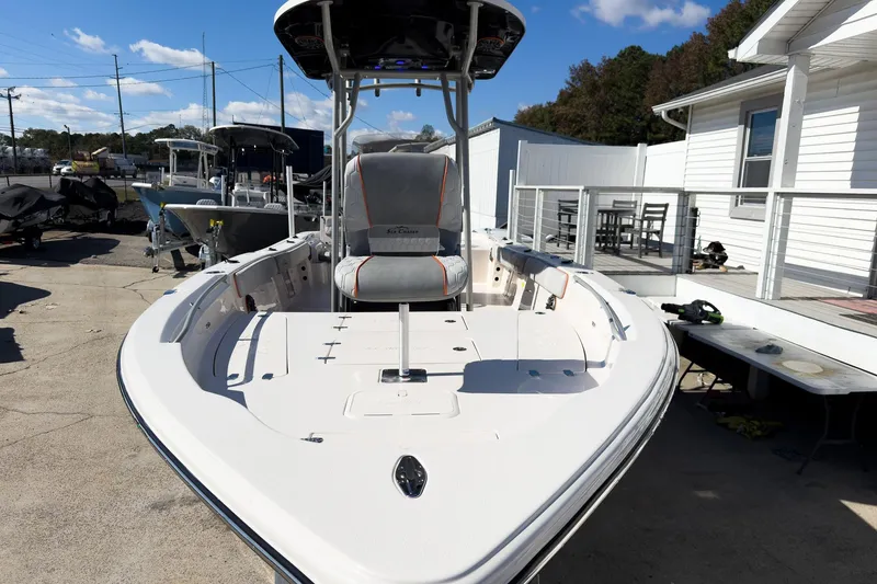 Slide: The Image of 2026 Sea Chaser 26 LX Special Edition boat with McLaren 300 engine, parked on a trailer. - 17