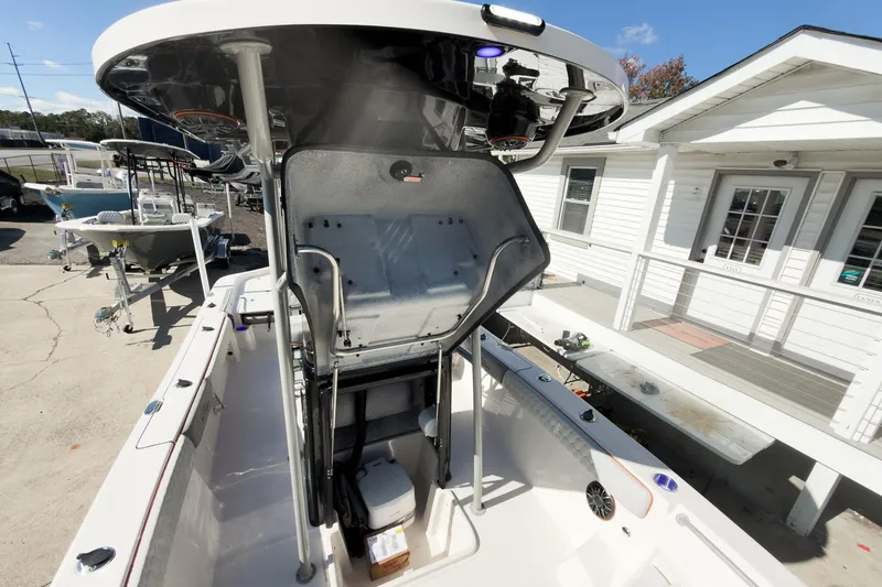 Slide: The Image of Control panel of 2026 Sea Chaser 26 LX Special Edition boat with steering wheel and electronic displays. - 20