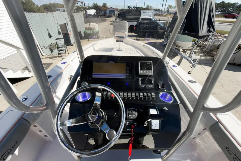 Slide: The Image of Open storage compartments on a 2026 Sea Chaser 26 LX Special Edition boat. - 26