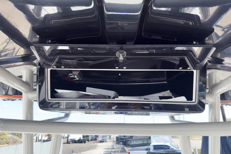 Slide: The Image of 2026 Sea Chaser 26 LX Special Edition boat interior with steering console and seating. - 38