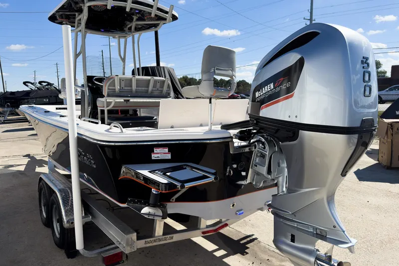 Slide: The Image of 2026 Sea Chaser 26 LX Special Edition boat displayed at an indoor exhibition. - 4