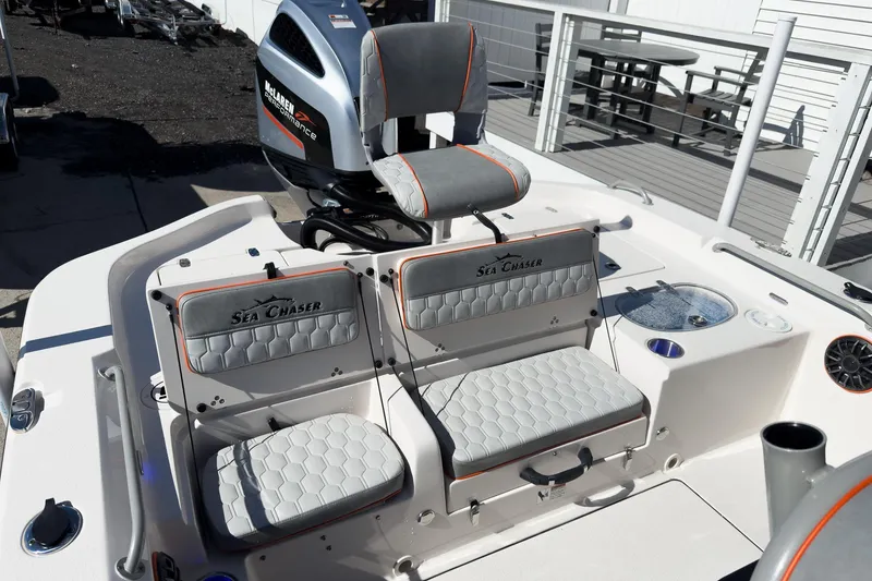 Slide: The Image of 2026 Sea Chaser 26 LX Special Edition boat displayed at an indoor exhibition. - 5