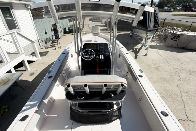 Slide: The Image of 2026 Sea Chaser 26 LX Special Edition boat with McLaren Performance engine at indoor exhibition. - 6