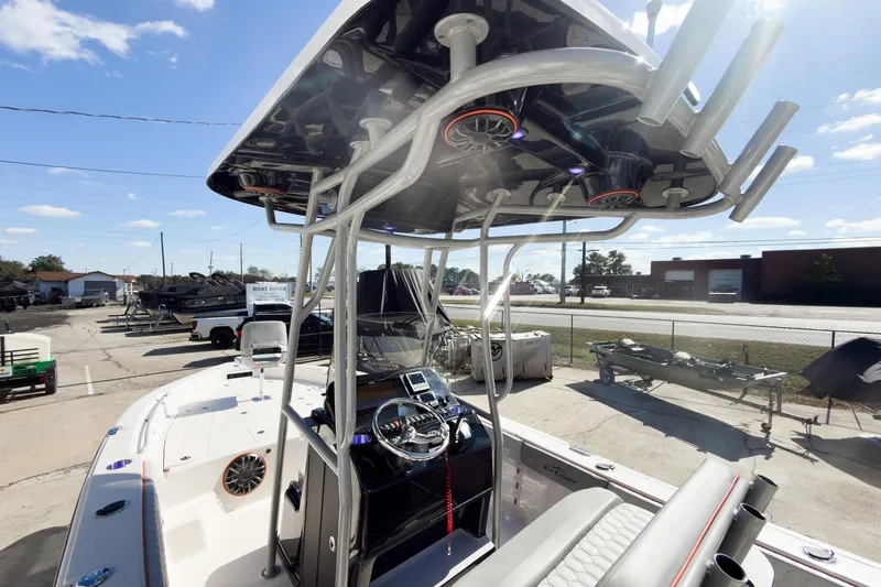 Slide: The Image of 2026 Sea Chaser 26 LX Special Edition boat displayed at an indoor boat show. - 8