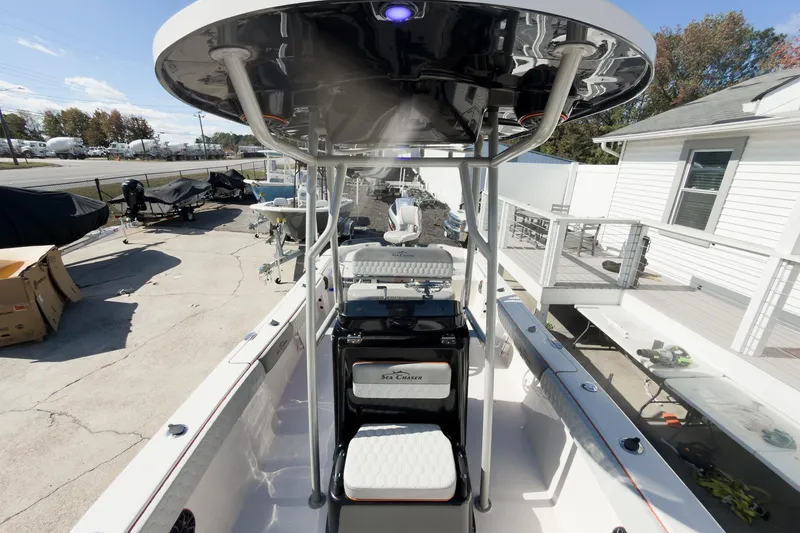 Slide: The Image of 2026 Sea Chaser 26 LX Special Edition boat displayed at an indoor exhibition. - 9