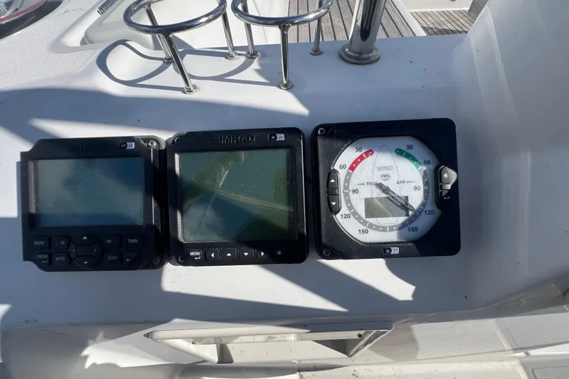Slide: The Image of Beneteau Oceanis 45 2012 yacht instruments, including Simrad displays and wind gauge. - 10
