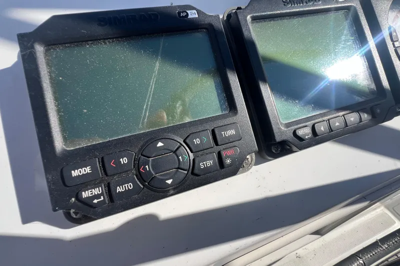 Slide: The Image of Simrad navigation displays on a 2012 Beneteau Oceanis 45 yacht, showing control buttons. - 11