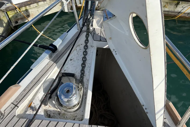 Slide: The Image of Beneteau Oceanis 45 (2012) anchor locker with chain and winch, dockside view. - 15