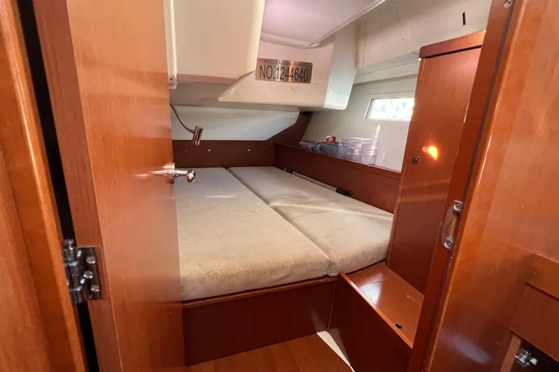 Slide: The Image of Cozy cabin interior of 2012 Beneteau Oceanis 45 sailboat with wooden finish. - 29