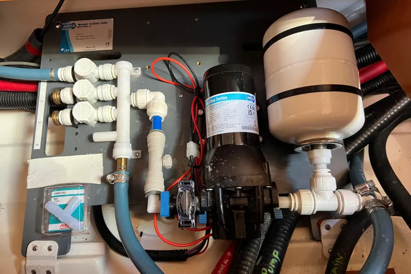 Slide: The Image of Beneteau Oceanis 45 2012 yacht plumbing system with Jabsco pump and fittings. - 34