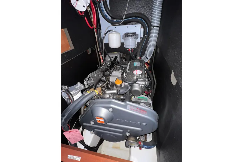 Slide: The Image of Engine compartment of a 2012 Beneteau Oceanis 45 sailboat, featuring a Yanmar engine. - 35