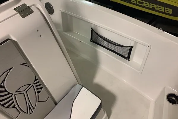 Slide: The Image of 2018 Scarab SB1195 Open boat interior with storage net and logo design. - 3