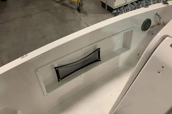 Slide: The Image of 2018 Scarab SB1195 Open boat interior with storage net and clean white finish. - 4