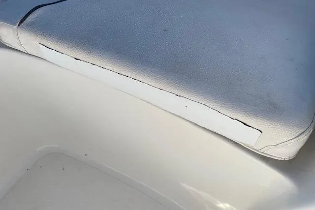 Slide: The Image of Worn seat cushion on 2014 Sea Hunt Escape 235 SE boat. - 10