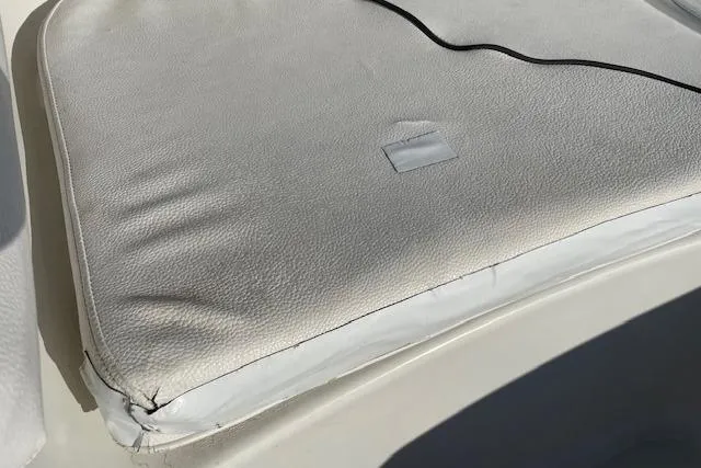 Slide: The Image of Cushion on 2014 Sea Hunt Escape 235 SE boat, showing wear and tear. - 12