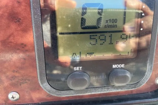 Slide: The Image of Close-up of a 2014 Sea Hunt Escape 235 SE dashboard display showing engine metrics. - 14