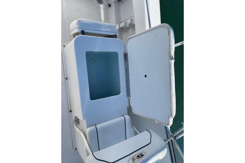 Slide: The Image of Open storage compartment on a 2014 Sea Hunt Escape 235 SE boat. - 17