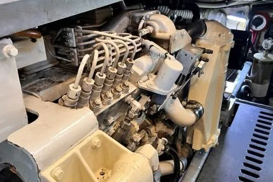 Slide: The Image of Engine compartment of a 2001 Luhrs 40 Convertible boat, showcasing mechanical components. - 18