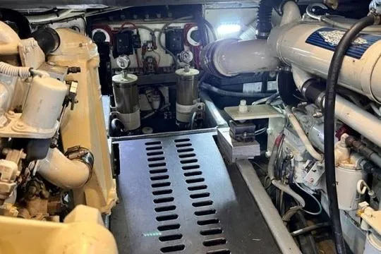 Slide: The Image of Engine compartment of a 2001 Luhrs 40 Convertible boat, showcasing mechanical components. - 19