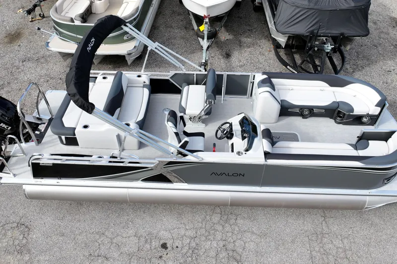 Slide: The Image of 2026 Avalon LSZ Entertainer pontoon boat with sleek design and spacious seating. - 10