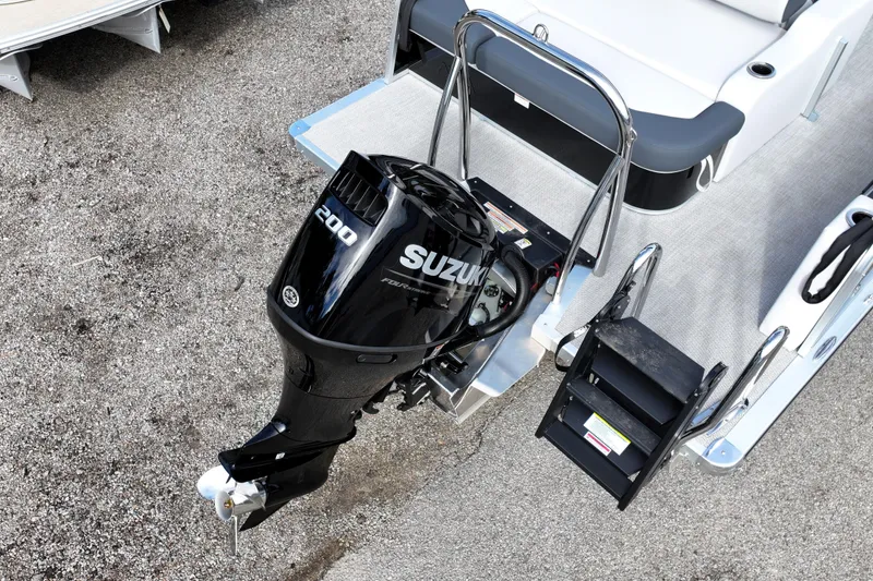 Slide: The Image of 2026 Avalon LSZ ENTERTAINER with Suzuki 200 outboard motor, rear view. - 2