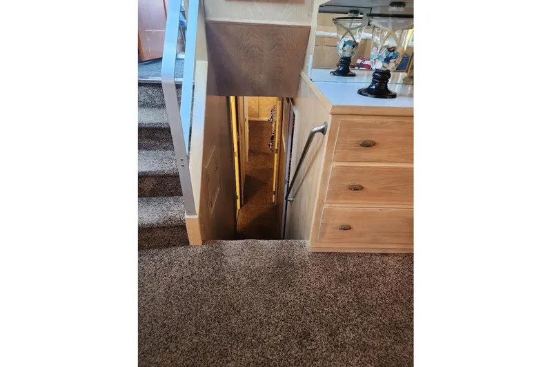 Slide: The Image of Interior of 1968 Burger Motor Yacht with stairs and wooden cabinetry. - 17