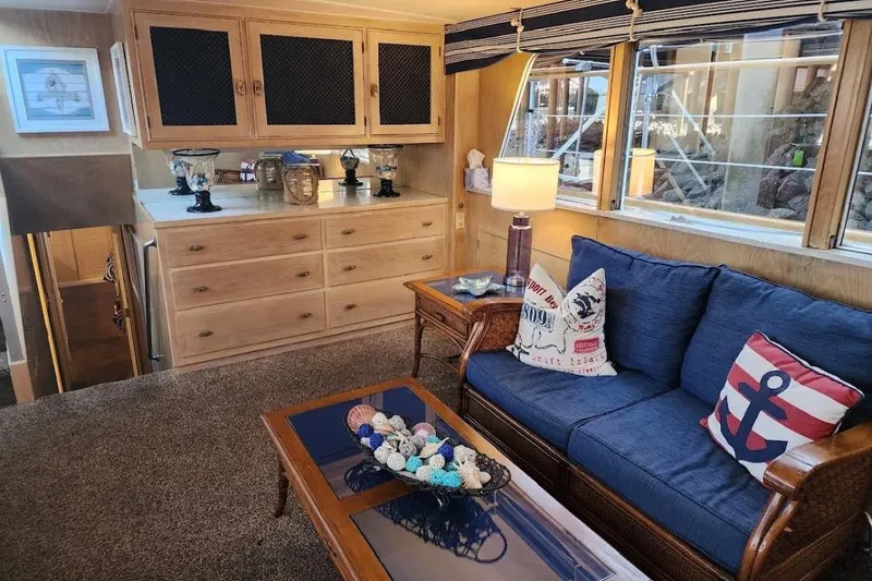 Slide: The Image of Cozy 1968 Burger Motor Yacht interior with nautical-themed decor and comfortable seating. - 24