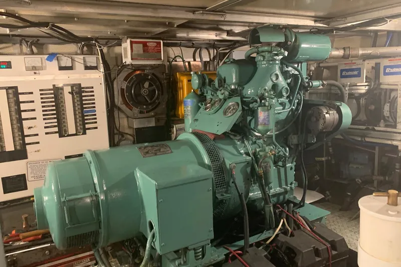 Slide: The Image of Engine room of a 1968 Burger Motor Yacht with vintage machinery and control panels. - 28