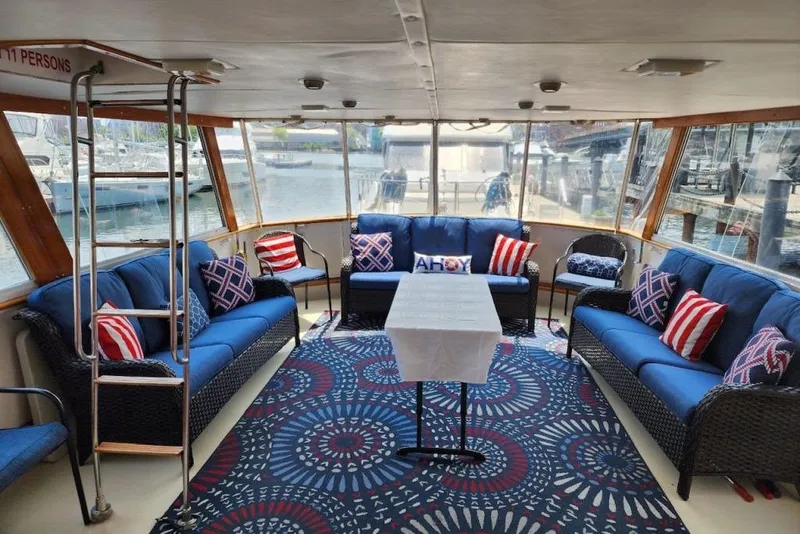 Slide: The Image of Luxurious 1968 Burger Motor Yacht interior with nautical-themed seating and decor. - 8