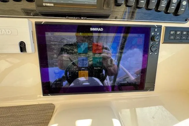 Slide: The Image of Simrad display on 2021 Grady-White Freedom 307 boat dashboard. - 30