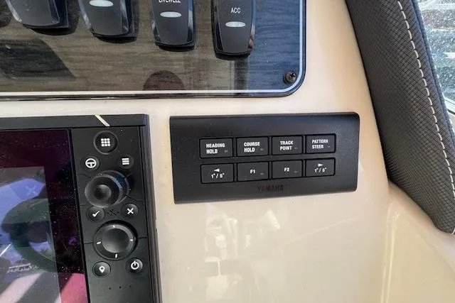 Slide: The Image of Control panel of a 2021 Grady-White Freedom 307 boat with navigation buttons. - 31