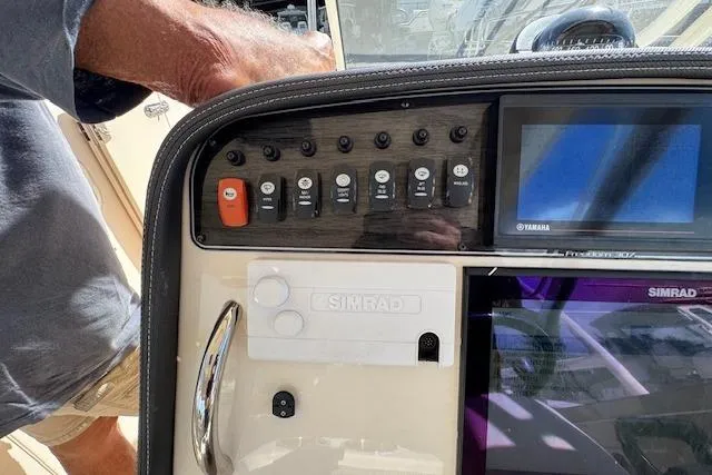 Slide: The Image of Control panel of 2021 Grady-White Freedom 307 boat with Simrad electronics. - 33
