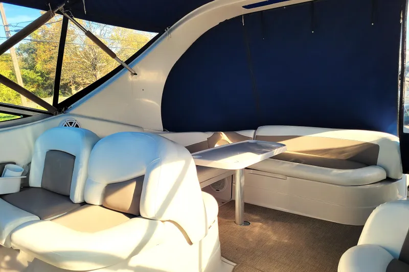 Slide: The Image of Interior of 2004 Wellcraft 3700 Martinique boat with seating and table. - 15