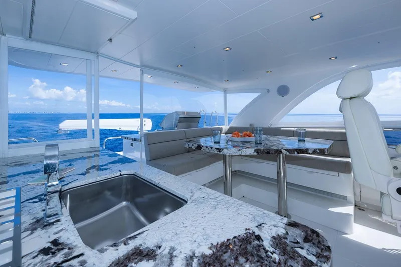 Slide: The Image of Luxurious 2019 Regency P65 yacht interior with marble countertops and ocean view. - 15