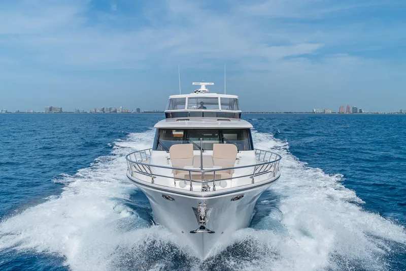 Slide: The Image of Luxurious 2019 Regency P65 yacht cruising on open blue sea. - 2