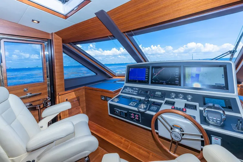 Slide: The Image of Luxurious 2019 Regency P65 yacht helm with advanced navigation systems and ocean view. - 35