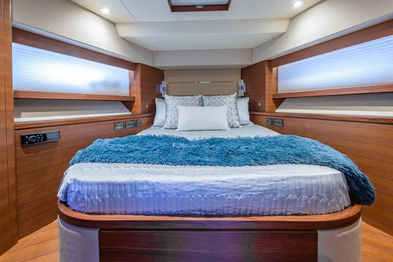 Slide: The Image of Luxurious bedroom interior of 2019 Regency P65 yacht with plush bedding and modern design. - 41