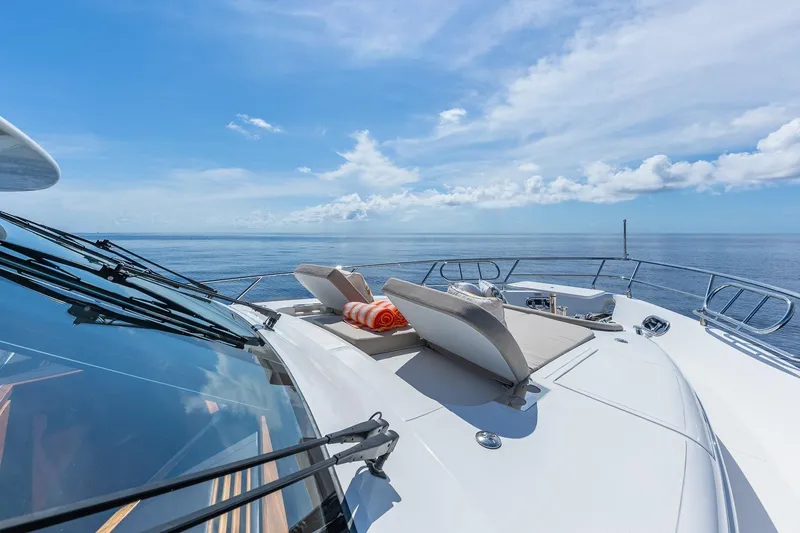 Slide: The Image of Luxurious 2019 Regency P65 yacht deck with sun loungers and ocean view. - 8